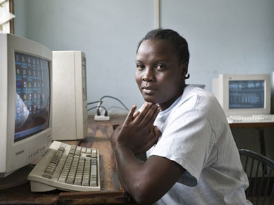African woman sitting at a computer