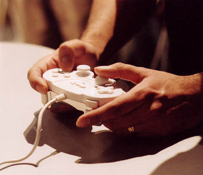 Close up of hands holding a video games controller
