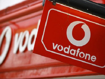 Red Vodafone sign with logo